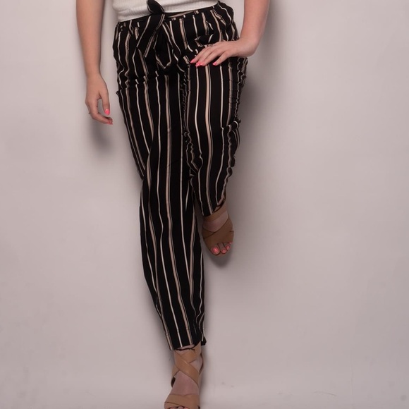 Black and white stripped pants that tie with a matching “belt”. - Picture 2 of 2